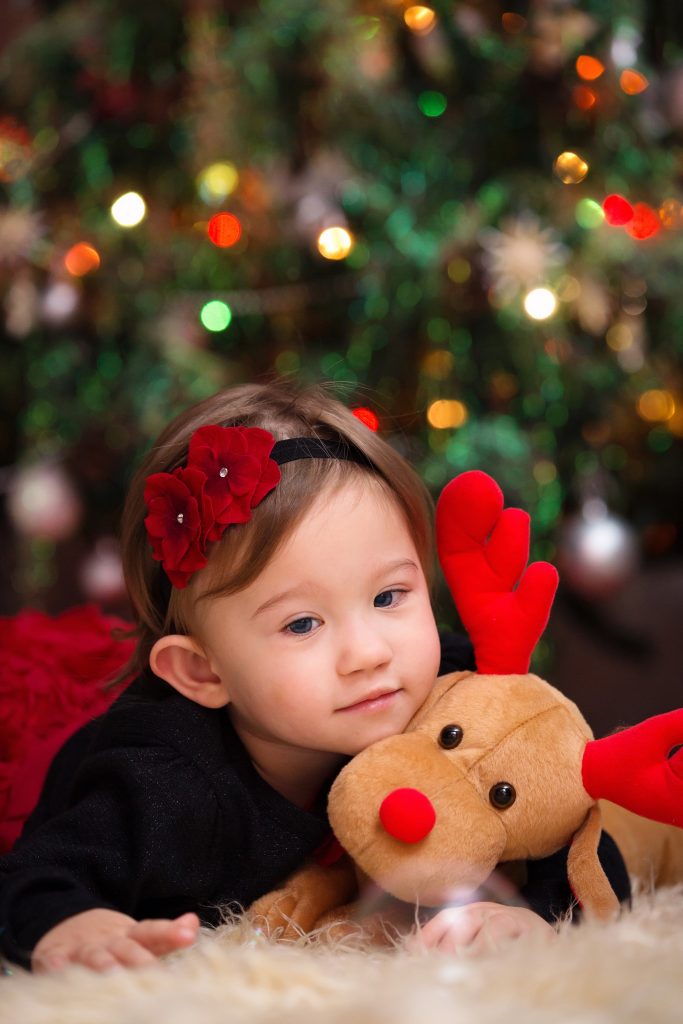 Baby Girl Under Christmas Tree